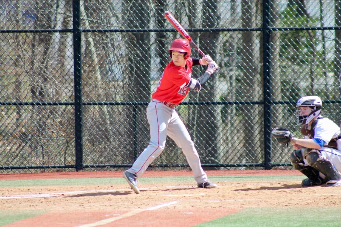 Henry batting during a baseball game